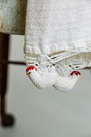 Detail of crocheted chickens on tea towel 