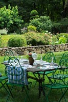 Outdoor table and iron chairs
