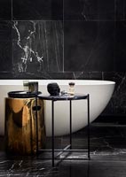 Marble tiling in modern black and white bathroom 