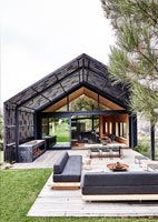 Modern house and gardens with outdoor living area 