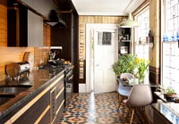 Modern kitchen with patterned flooring 