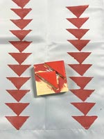 Red triangle stamp used to decorate fabric
