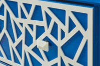 Detail of blue and white patterned chest of drawers 