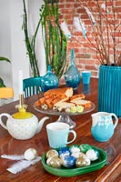 Modern dining table decorated for Easter holidays 