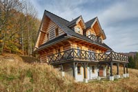 Wooden house on hillside 