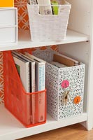 Filing boxes on bookcase shelves 