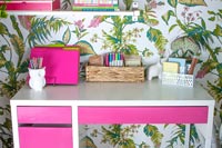 Modern home office with colourful wallpaper 