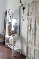 White console table with mannequin