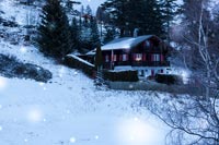 Chalet in the snow at night 