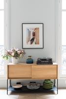 Wooden sideboard storing plates 