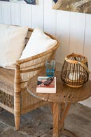 Book and sunglasses on wooden side table 