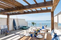 Outdoor dining area overlooking the sea 