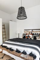Black, white and brown country bedroom with en-suite shower 