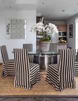 Black and white slipcovers on dining chairs 