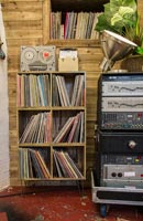 Shelves of vinyle records in music room - recording studio 