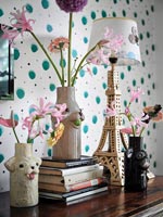 Flowers in vases and Eiffel Tower shaped lamp