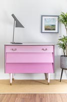 Finished set of drawers painted dusty pink with drawers in different shades - ombre paint effect.