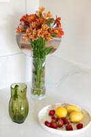 Vase of flowers and fruit bowl 