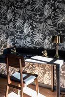 Black and silver wallpaper in study 