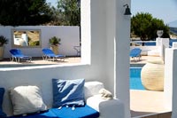 Relaxing outdoor seating area with view to swimming pool 