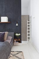 Modern bedroom with black painted dividing wall 
