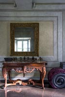 Ornately carved console table and mirror