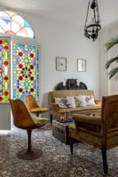 Colourful stained glass windows in living room 