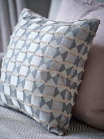 Grey patterned cushion detail 