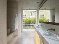Contemporary concrete and marble bathroom 