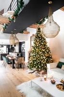Modern open plan living space decorated for Christmas 