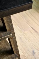 Detail of wooden kitchen island and flooring 