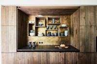 Modern wooden kitchen with wall mounted box shelves