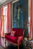 Colourful classic sitting room with large painting of nude 