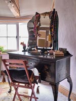 Antique dressing table in country bedroom 