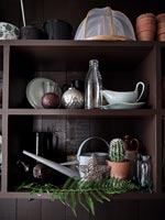 Christmas decorations on wooden kitchen shelving 