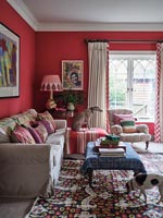 Pet dogs in colourful eclectic living room 