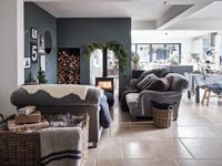 Open plan living space with central wood burner 