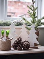 Detail of modern Christmas decorations and pinecones 