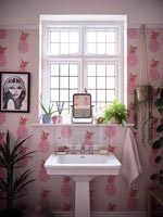 Pink pineapple wallpaper in modern bathroom 