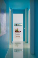 Bright turquoise painted corridor 
