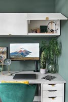 Open cabinet above desk in modern home office 