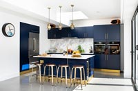 Navy blue kitchen with gold trim