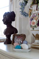 Bust and ornaments on sideboard 