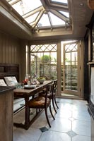 Country dining area with wood panelling
