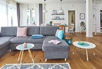Blue and pink accessories in modern open plan living space 