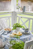 Food on small round table - country veranda 