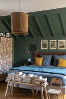 Cosy bedroom painted in green