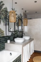 Skirts under twin sinks in modern bathroom with tropical wall mural