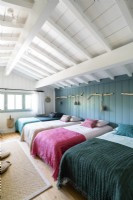 Dormitory style bedroom in coastal cabin with four beds 
