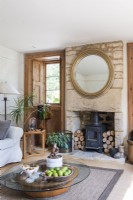 Fireplace and exposed stone chimney breast in country living room